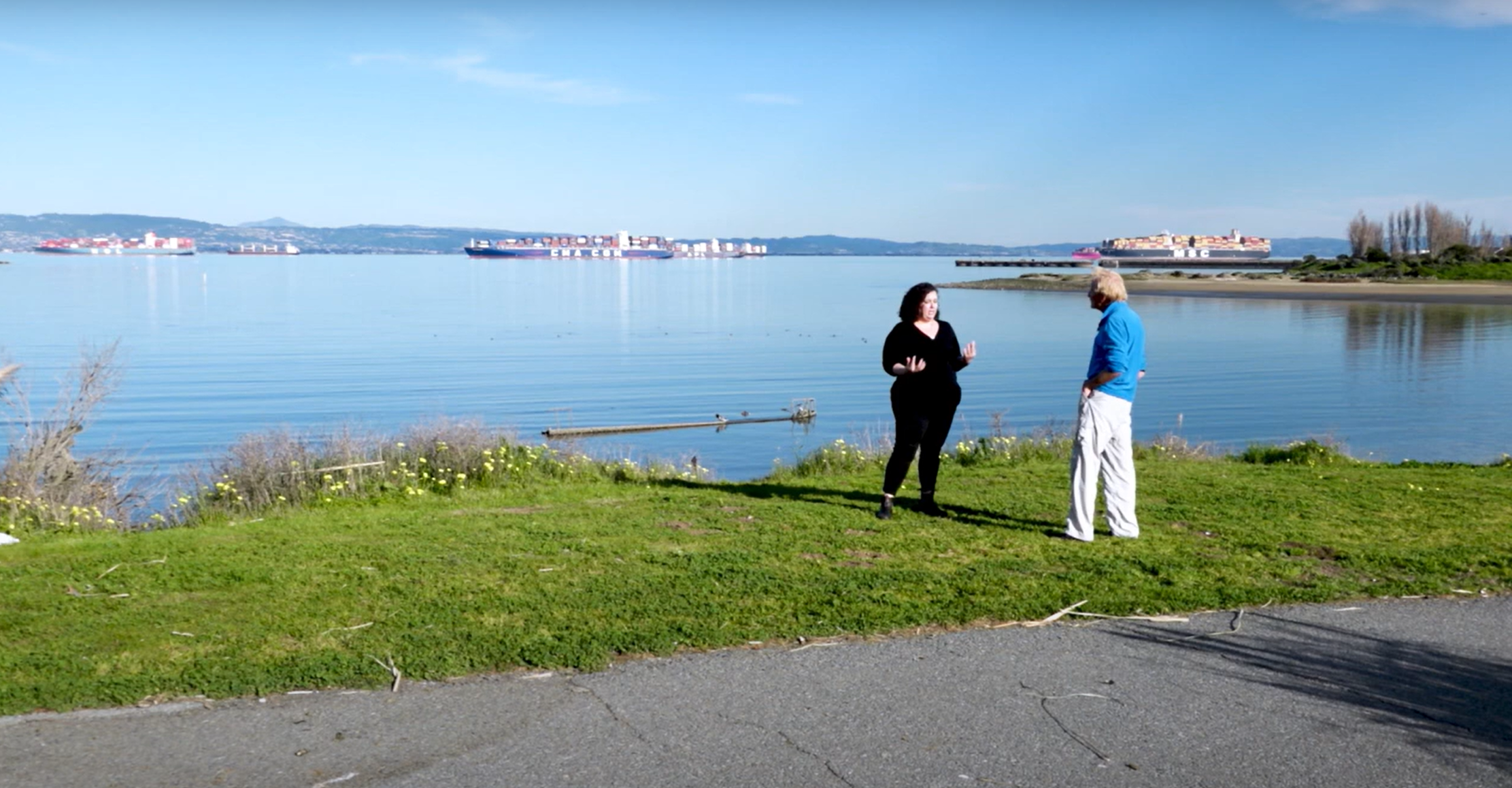 WRMP Program Manager Heidi Nutters talking to Doug McConnell on the shoreline of San Francisco Bay